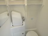 The washroom includes a Thetford swivel toilet, fold-down sink and a shower