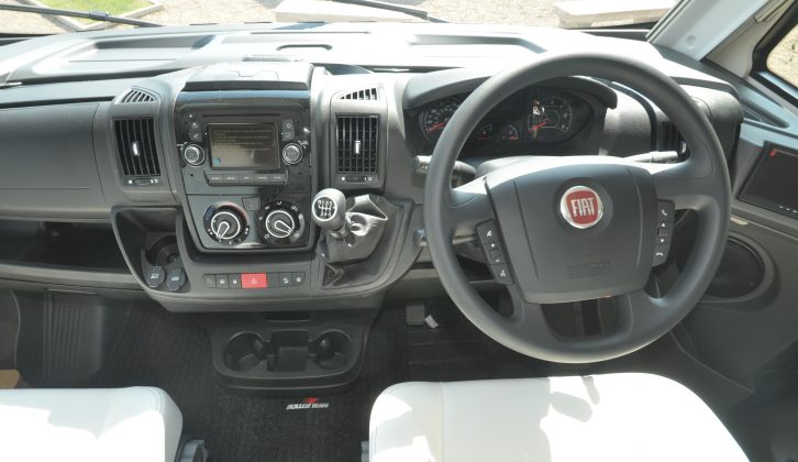 The cab has a few upgrades, including a reversing monitor and bluetooth connectivity