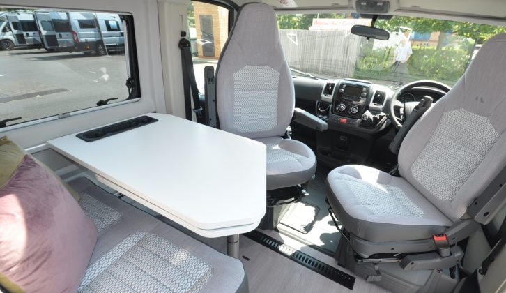 The four-seater lounge is typical in this class of motorhome, with the bonus of a handy extension to the table
