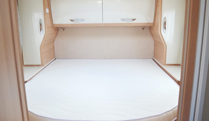 The island bed is surrounded by storage; there is a half-length wardrobe either side, two overhead lockers and even more space below the bed