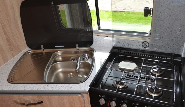The kitchen sink has its own permanent drainer, but this does limit the work surface
