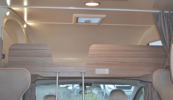 The luxurious overcab bed has three shelves, a window, two spotlights and a rooflight