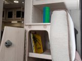 Cleverly designed storage includes this neat trapezoid cupboard, which has a useful shelf and is tucked in just behind the travel seat
