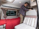 If you're using the beds as two singles, the travel seat transforms into a bed by moving the easily accessible catch and adding an extension flap