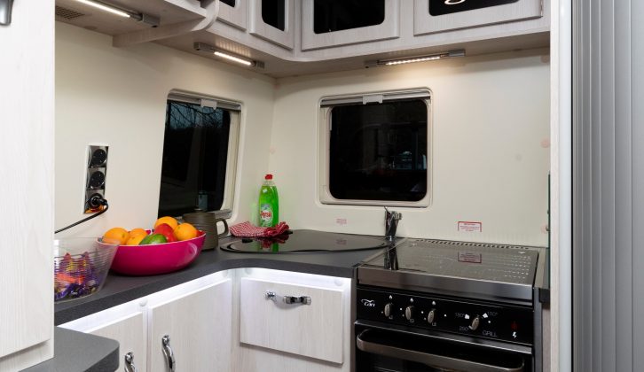 The well-planned kitchen has lots of storage space for equipment and an 800W Russell Hobbs microwave fitted at head height