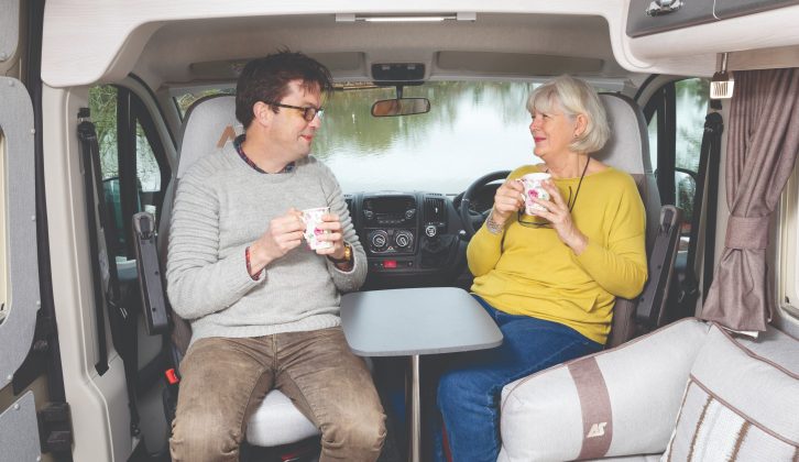 The small pedestal table that sits between the cab seats when they are swivelled is large enough for drinks and snacks, but not a full meal