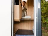 Clever design includes a tall door providing access to the capacious wardrobe from both inside and outside the motorhome