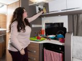 Storage space in the kitchen is reasonable, with drawers below the sink and overhead locker capacity, and there's a handy spice rack on the wall