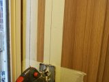 Mark out the access hole in the cupboard side onto masking tape and drill a hole in each corner. When cutting, always keep the jigsaw breastplate firmly against the surface