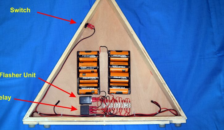 Inside completed warning triangle. Flasher unit and relay are attached to plywood using double-sided sticky pads