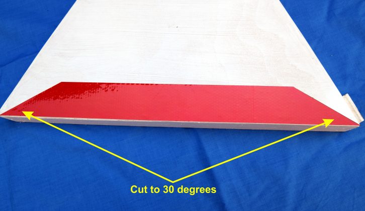 Cut three strips of red reflective tape and stick to the three sides as shown