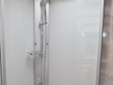 The shower cubicle benefits from full plastic lining