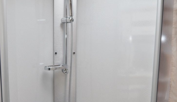 The shower cubicle benefits from full plastic lining