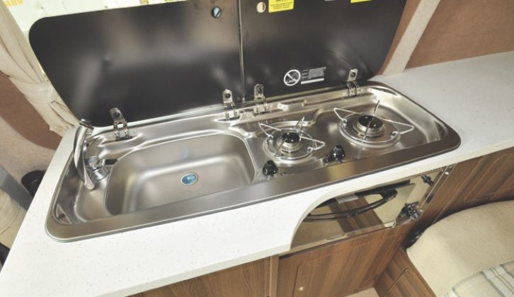 Conventional campervan kitchen? A grill supplements the usual two-ring hob and sink