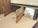 Underseat storage includes a Dometic portable toilet