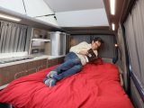 Bench seat easily turns into a spacious double bed, with spotlights and a wireless charger to hand here, too
