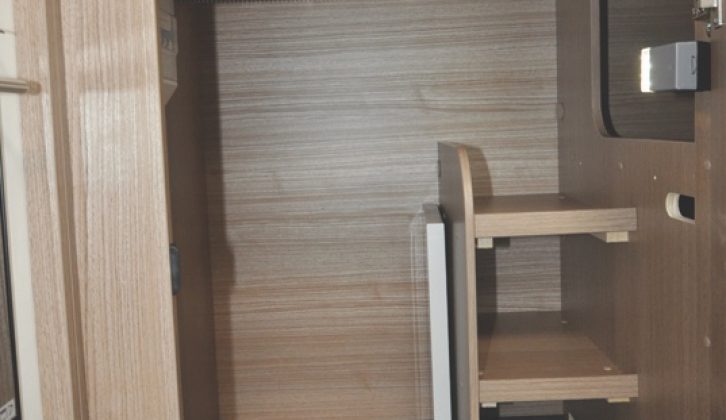 The second wardrobe, which has some useful shelving, is located underneath the bed