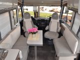 The elegant lounge in the Trend I 6757 DBL features the currently fashionable parallel seating arrangement and chic decor in neutral shades of cream and grey