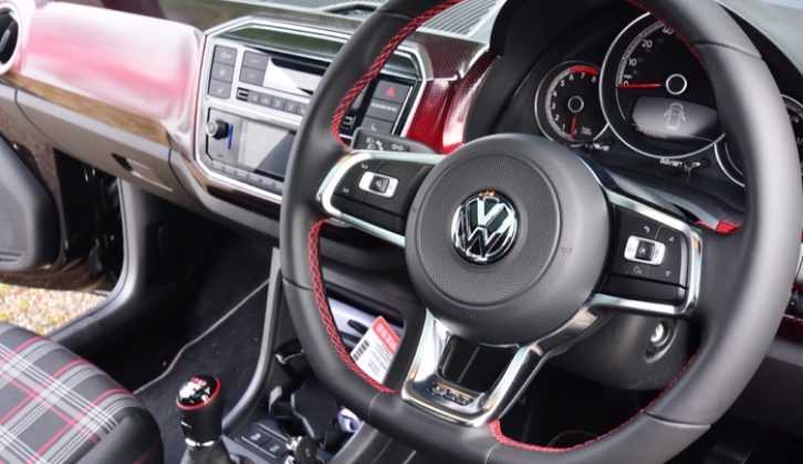 Sporty leather steering wheel but it only adjusts up and down