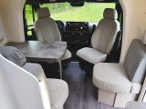 The roomy front lounge in the Neo looks bright and airy, with clever use of light fabrics and finishes