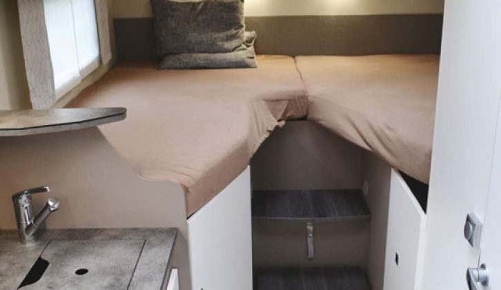 The single beds at the rear of the Neo are easily reached by a couple of steps, with storage space below the comfortable mattresses