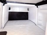 The rear bed in the James Cook campervan is large for any motorhome, let alone a van conversion, thanks to a slide-out at the back