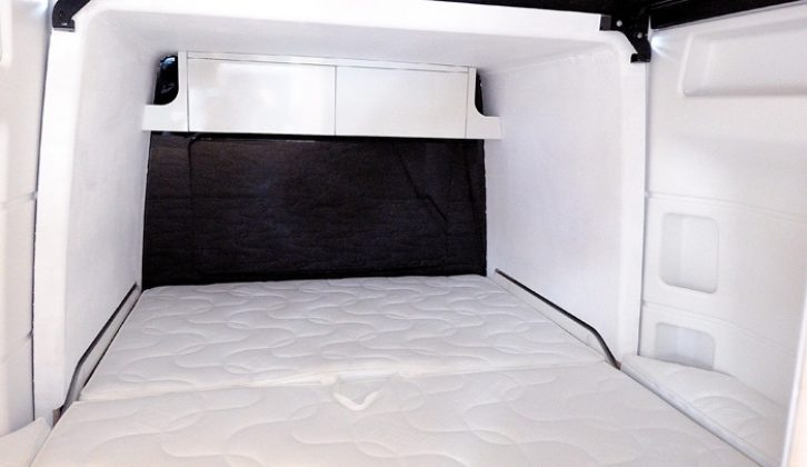 The rear bed in the James Cook campervan is large for any motorhome, let alone a van conversion, thanks to a slide-out at the back