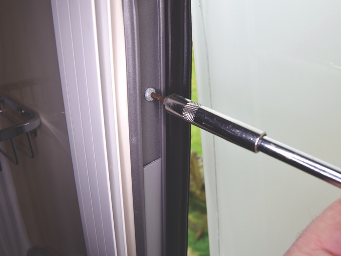 Remove the end-stop screw from the left-hand side of the window frame.