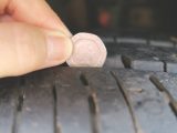 Insert a 20p coin into the tyre tread and, if the outer band is obscured, the tread depth is within the legal limit