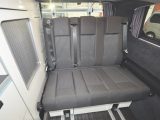 The rear seat can squeeze in three passengers for travel