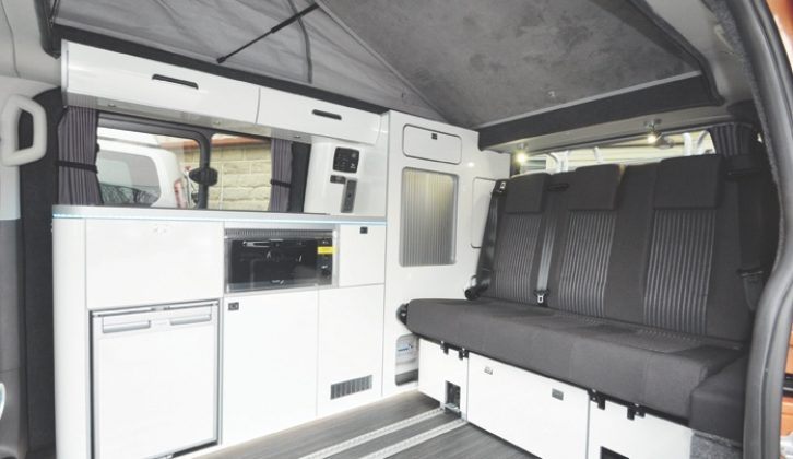 The stylish interior combines Italian furniture, a German sliding seat and an English elevating roof
