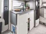 Compact kitchen in the On Tour Edition V 65 GQ has an extension, 140-litre slimline fridge and ample storage space