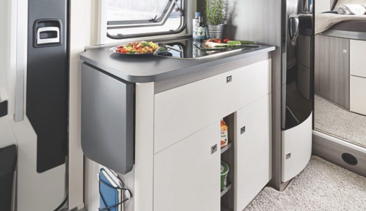 Compact kitchen in the On Tour Edition V 65 GQ has an extension, 140-litre slimline fridge and ample storage space