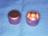 Conventional 22mm copper blanking caps, available from any DIY store
