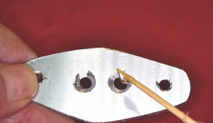 Countersink the two holes as shown and then apply epoxy adhesive to the surfaces. Insert two M4 x 6 countersunk stainless steel screws and allow to set