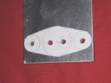 Drill holes as shown using a 4mm drill and then cut around the periphery using a hacksaw and file