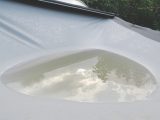 Gently release any water pooled on the awning roof, to avoid stretching the fabric