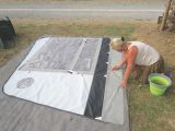 Laying out the awning side panels on the groundsheet makes them easier to clean