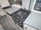 The kitchen offers permanent worktop either side of the cooker