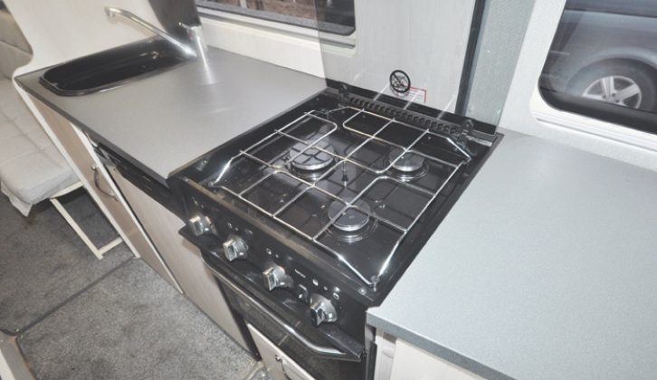 The kitchen offers permanent worktop either side of the cooker