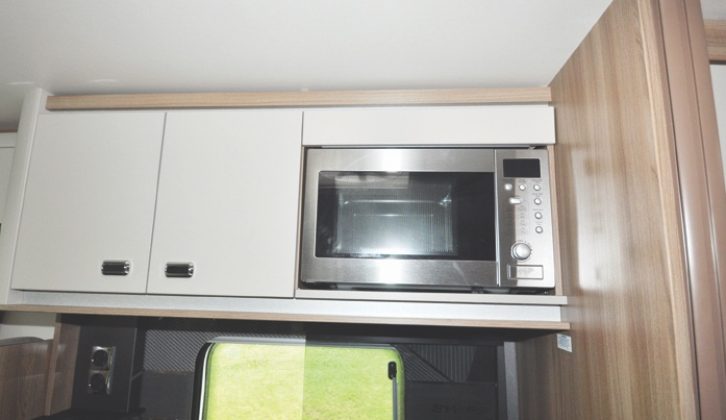 A microwave is standard, and sensibly fitted over the hob