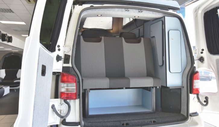 Rear has two roomy seats, plus storage, and barn doors