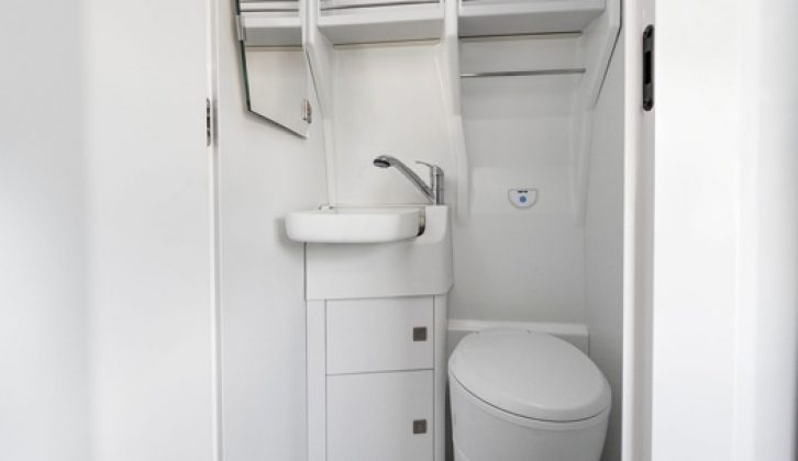 The washroom looks rather like what you might find in an aeroplane - white moulded surfaces and a fold-up basin