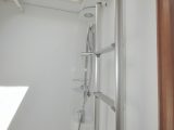 The bed ladder stowed in the washroom could be handy for hanging clothes and towels to dry