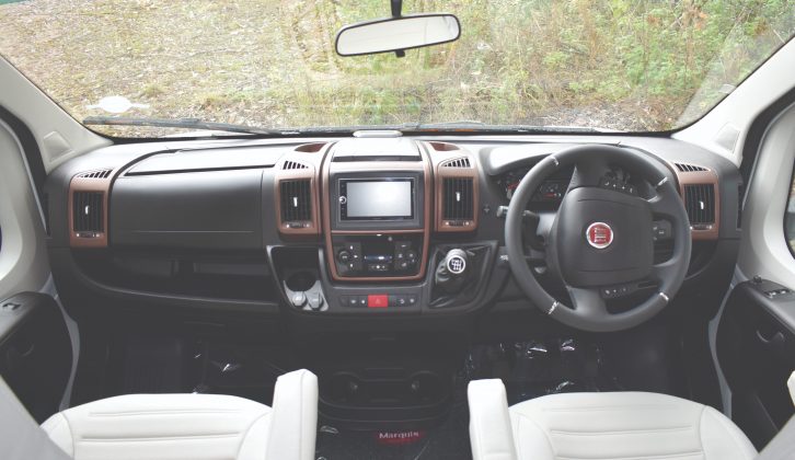 It has the standard Fiat Ducato cab with drinks holders in the middle, but you will also get sat nav included in the UK price