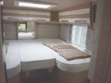 The fixed single beds are set quite high up, but are easy to get into , and have well-padded headboards - although headroom is a bit limited
