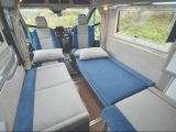 Staggered single beds put the heads at the front end. The offside single can be further extended if you use the cab seat
