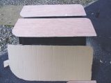 Creating a template in cardboard before cutting out two pieces of plywood