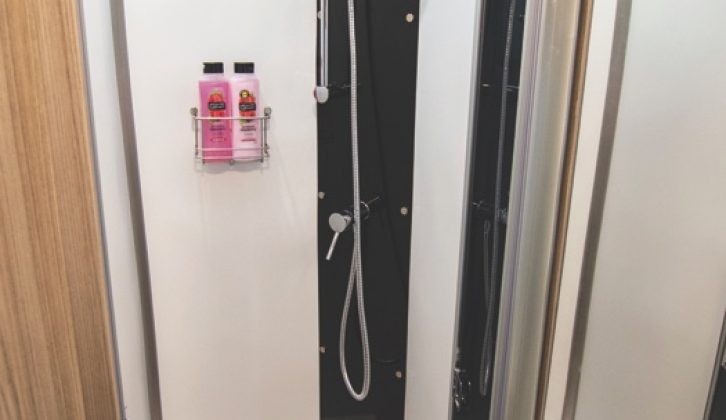 Lined shower cubicle is a good size and includes riser bar and storage rack