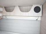 Comfortable headboard and two spotlights for the fixed double bed